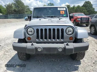 2013 Jeep Wrangler Unlimited Sport with VIN 1C4BJWDG4DL628518, listed as a Copart auction lot 65029795 with 142,852 mi miles and Salvage title. Bid and sale history available at DreamBid. Image 5.