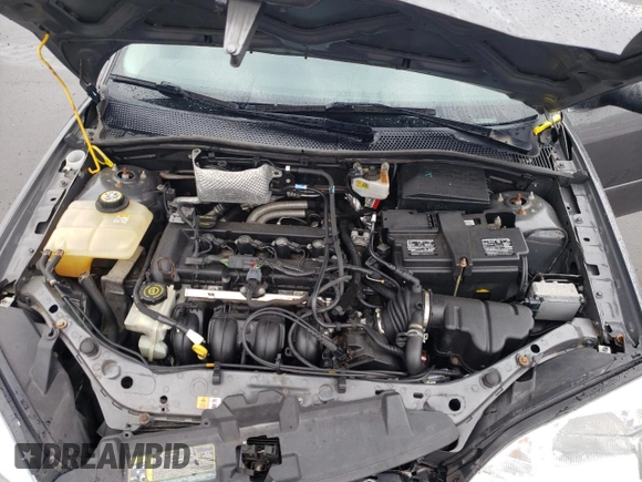 2007 Ford Focus S z VIN 1FAHP34N07W177912, wystawiony jako Copart lot #60481025 z przebiegiem 114 086 mil mil oraz Szkoda całkowita • Salvage title. Historia ofert i sprzedaży dostępna na DreamBid. Obrazek 11.