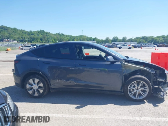 2023 Tesla Model Y Long Range with VIN 7SAYGDEE4PA037218, listed as a IAAI auction lot 42232704 with 18,756 mi miles and . Bid and sale history available at DreamBid. Image 14.
