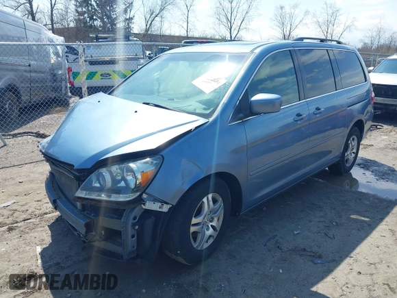 2007 Honda Odyssey EX-L with VIN 5FNRL38727B092077, listed as a IAAI auction lot 41972810 with 211,770 mi miles and . Bid and sale history available at DreamBid. Image 18.