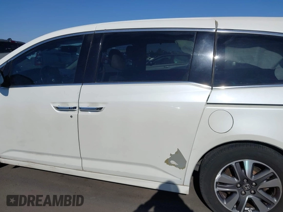 2014 Honda Odyssey Touring with VIN 5FNRL5H97EB037361, listed as a IAAI auction lot 42106742 with 198,279 mi miles and . Bid and sale history available at DreamBid. Image 14.