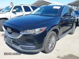 2019 Mazda CX-5 Sport with VIN JM3KFABM7K1579747, listed as a IAAI auction lot 41965097 with 151,042 mi miles and . Bid and sale history available at DreamBid. Image 2.
