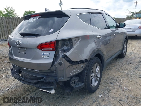 2018 Hyundai Santa Fe 2.4L z VIN 5NMZUDLB4JH073857, wystawiony jako IAAI lot #42200208 z przebiegiem 127 038 mil mil oraz . Historia ofert i sprzedaży dostępna na DreamBid. Obrazek 4.