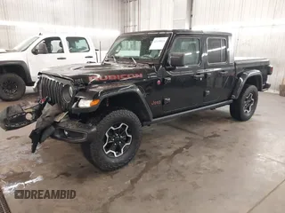 2021 Jeep Gladiator Rubicon with VIN 1C6JJTBGXML529108, listed as a IAAI auction lot 42139924 with 32,204 mi miles and . Bid and sale history available at DreamBid. Image 2.