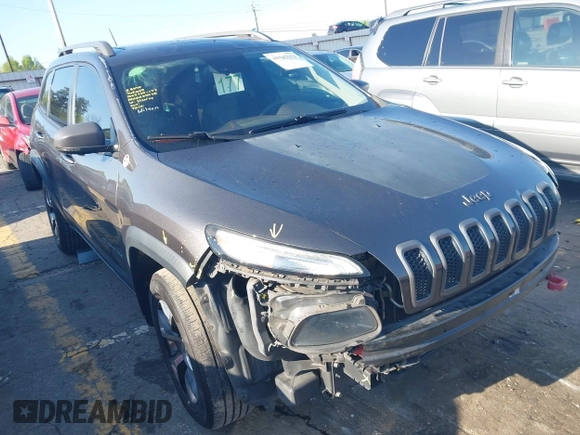 2014 Jeep Cherokee Trailhawk with VIN 1C4PJMBS6EW167517, listed as a IAAI auction lot 41947552 with 233,572 mi miles. Bid and sale history available at carsss.com. Image 1.