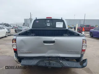 2009 Toyota Tacoma PreRunner with VIN 3TMJU62NX9M081748, listed as a IAAI auction lot 41608525 with 210,999 mi miles. Bid and sale history available at carsss.com. Image 6.