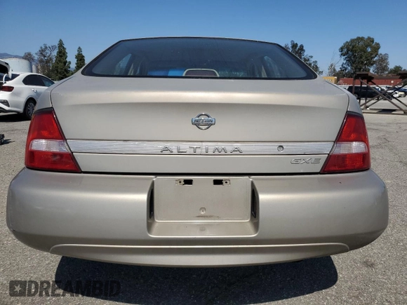 2000 Nissan Altima XE z VIN 1N4DL01D5YC243801, wystawiony jako Copart lot #52642985 z przebiegiem 237 665 mil mil oraz Szkoda całkowita • Salvage title. Historia ofert i sprzedaży dostępna na DreamBid. Obrazek 6.