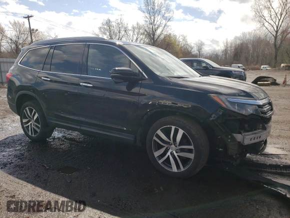 2017 Honda Pilot Touring with VIN 5FNYF6H90HB028112, listed as a Copart auction lot 52197645 with 218,944 mi miles and Salvage Title. Bid and sale history available at DreamBid. Image 4.