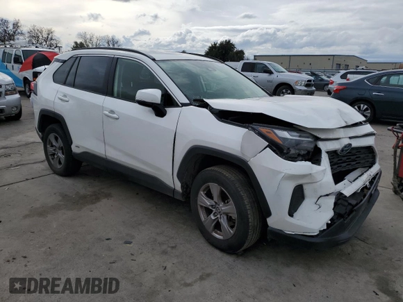 2023 Toyota RAV4 Hybrid LE with VIN JTMMWRFV3PD570648, listed as a Copart auction lot 86983174 with 27,258 mi miles and Salvage title. Bid and sale history available at DreamBid. Image 4.