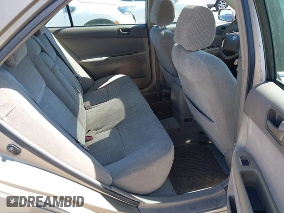 2002 Toyota Camry XLE z VIN 4T1BF30K82U018974, wystawiony jako IAAI lot #41712857 z przebiegiem 236 353 mil mil oraz . Historia ofert i sprzedaży dostępna na DreamBid. Obrazek 8.