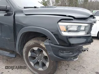 2019 Ram 1500 Rebel z VIN 1C6SRFLT1KN722064, wystawiony jako IAAI lot #41513201 z przebiegiem 113 559 mil mil oraz . Historia ofert i sprzedaży dostępna na DreamBid. Obrazek 19.