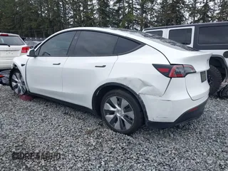 2023 Tesla Model Y Long Range with VIN 7SAYGDEE7PF809164, listed as a IAAI auction lot 41828974 with 31,772 mi miles. Bid and sale history available at carsss.com. Image 3.