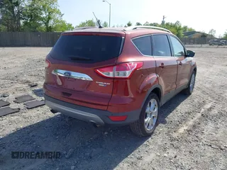 2016 Ford Escape Titanium with VIN 1FMCU9JX9GUA16892, listed as a IAAI auction lot 42110986 with 87,775 mi miles and . Bid and sale history available at DreamBid. Image 4.