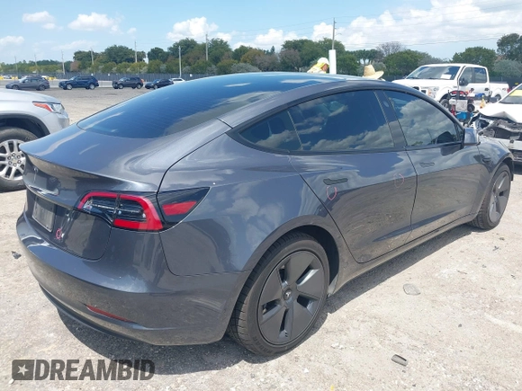 2023 Tesla Model 3 with VIN 5YJ3E1EAXPF575448, listed as a IAAI auction lot 42019288 with 33,859 mi miles and . Bid and sale history available at carsss.com. Image 4.
