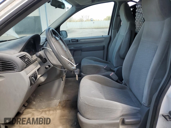 2007 Ford Freestar Cargo z VIN 2FTZA54647BA13617, wystawiony jako Copart lot #52545745 z przebiegiem Nie podano mil oraz Szkody całkowita. Historia ofert i sprzedaży dostępna na DreamBid. Obrazek 7.