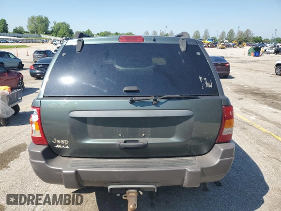 2002 Jeep Grand Cherokee Laredo with VIN 1J4GW48S02C174656, listed as a Copart auction lot 56954155 with 235,427 mi miles and Salvage title. Bid and sale history available at DreamBid. Image 6.