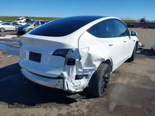 2023 Tesla Model Y Long Range with VIN 7SAYGDEE0PF945202, listed as a IAAI auction lot 41611762 with 7,316 mi miles and . Bid and sale history available at DreamBid. Image 6.