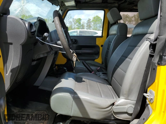2009 Jeep Wrangler X with VIN 1J4FA241X9L765664, listed as a Copart auction lot 51802065 with 137,053 mi miles and Salvage Title. Bid and sale history available at DreamBid. Image 7.