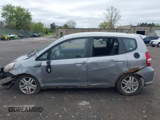 2007 Honda Fit Sport z VIN JHMGD38687S017199, wystawiony jako IAAI lot #42156912 z przebiegiem 194 685 mil mil oraz . Historia ofert i sprzedaży dostępna na DreamBid. Obrazek 15.