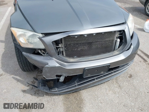 2012 Dodge Caliber SXT with VIN 1C3CDWDA6CD506019, listed as a IAAI auction lot 41999560 with 146,446 mi miles and . Bid and sale history available at DreamBid. Image 6.