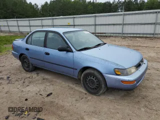 1995 Toyota Corolla DX with VIN 2T1AE09B5SC127586, listed as a Copart auction lot 57075045 with 244,969 mi miles and Salvage title. Bid and sale history available at DreamBid. Image 4.