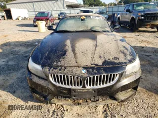 2011 BMW Z4 sDrive35i with VIN WBALM7C5XBE383093, listed as a Copart auction lot 74487034 with 0 mi miles and Salvage Title. Bid and sale history available at carsss.com. Image 5.
