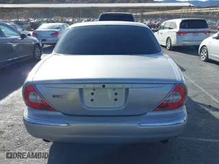 2004 Jaguar XJ with VIN SAJWA73B94TG30153, listed as a IAAI auction lot 41218841 with 91,158 mi miles. Bid and sale history available at carsss.com. Image 16.
