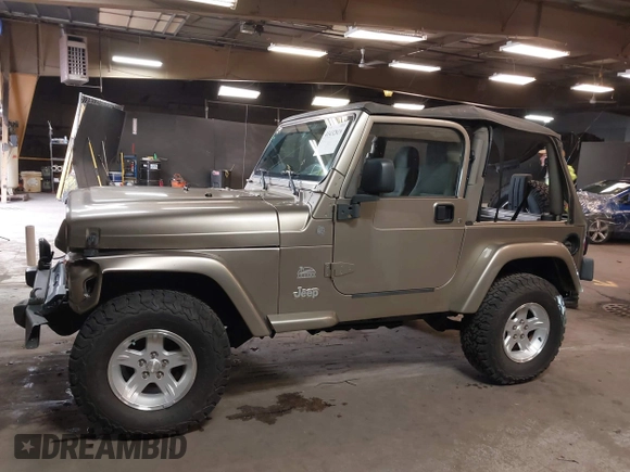 2004 Jeep Wrangler Sahara with VIN 1J4FA59S64P736389, listed as a IAAI auction lot 41432819 with 102,830 mi miles and . Bid and sale history available at DreamBid. Image 14.