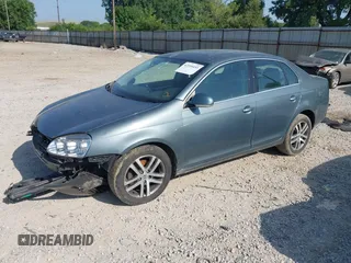2006 Volkswagen Jetta 2.5L z VIN 3VWSF71K06M798437, wystawiony jako IAAI lot #42559453 z przebiegiem 169 485 mil mil oraz . Historia ofert i sprzedaży dostępna na DreamBid. Obrazek 18.