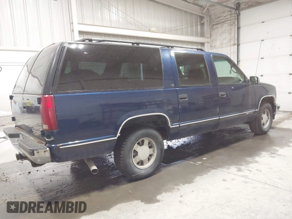 1999 Chevrolet Suburban with VIN 3GNEC16RXXG237570, listed as a IAAI auction lot 40210234 with 176,902 mi miles. Bid and sale history available at carsss.com. Image 4.