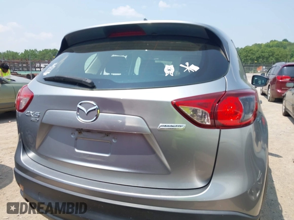 2014 Mazda CX-5 Sport with VIN JM3KE4BE9E0411177, listed as a IAAI auction lot 42411938 with 167,709 mi miles and . Bid and sale history available at DreamBid. Image 16.