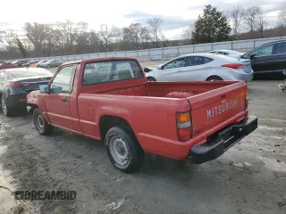 1991 Mitsubishi Mighty Max z VIN JA7FL24W3MP017705, wystawiony jako Copart lot #85737304 z przebiegiem 261 896 mil mil oraz Szkody całkowita. Historia ofert i sprzedaży dostępna na DreamBid. Obrazek 2.