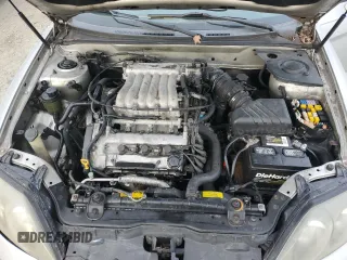 2003 Hyundai Tiburon GT z VIN KMHHN65F63U064962, wystawiony jako Copart lot #44804045 z przebiegiem 186 171 mil mil oraz Szkoda całkowita • Salvage title. Historia ofert i sprzedaży dostępna na DreamBid. Obrazek 12.