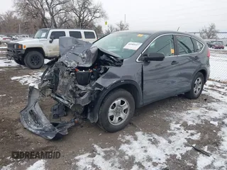 2015 Honda CR-V LX with VIN 2HKRM4H3XFH619055, listed as a IAAI auction lot 40989227 with 113,332 mi miles and . Bid and sale history available at DreamBid. Image 17.