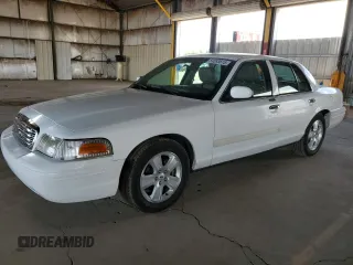 2011 Ford Crown Victoria LX z VIN 2FABP7EV6BX177311, wystawiony jako Copart lot #54093615 z przebiegiem 283 019 mil mil oraz Czysty tytuł • Clean title. Historia ofert i sprzedaży dostępna na DreamBid. Obrazek 1.