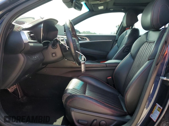 2023 Genesis G70 2.0T with VIN KMTG34TA5PU110175, listed as a Copart auction lot 58297715 with 43,716 mi miles and Salvage title. Bid and sale history available at DreamBid. Image 7.