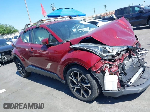 2019 Toyota C-HR XLE with VIN JTNKHMBX1K1060316, listed as a IAAI auction lot 41764464 with 42,956 mi miles. Bid and sale history available at carsss.com. Image 1.