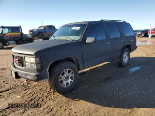 1997 GMC Yukon with VIN 1GKEK13R0VJ710179, listed as a Copart auction lot 81374234 with 186,257 mi miles and Salvage Title. Bid and sale history available at carsss.com. Image 1.