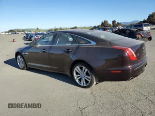 2014 Jaguar XJ with VIN SAJWA1CZ3E8V69877, listed as a Copart auction lot 48159005 with 57,567 mi miles and Clean Title. Bid and sale history available at DreamBid. Image 2.