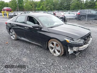 2018 Honda Accord Touring with VIN 1HGCV1F99JA113856, listed as a IAAI auction lot 42527718 with 63,376 mi miles and . Bid and sale history available at DreamBid. Image 1.