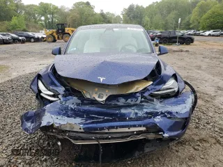 2022 Tesla Model Y Long Range z VIN 7SAYGDEE6NF318808, wystawiony jako Copart lot #57219915 z przebiegiem Nie podano mil oraz Szkoda całkowita • Salvage title. Historia ofert i sprzedaży dostępna na DreamBid. Obrazek 5.