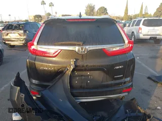 2019 Honda CR-V Touring with VIN 7FARW2H9XKE012394, listed as a IAAI auction lot 41092564 with 49,527 mi miles and . Bid and sale history available at DreamBid. Image 16.