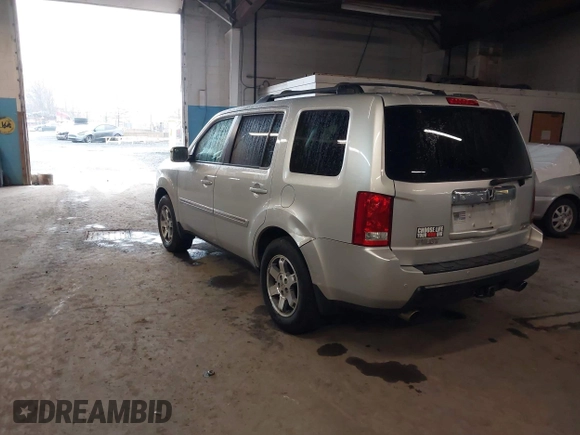 2009 Honda Pilot Touring with VIN 5FNYF48929B010331, listed as a IAAI auction lot 41965094 with 142,490 mi miles and . Bid and sale history available at carsss.com. Image 3.