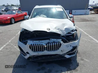 2020 BMW X1 xDrive28i with VIN WBXJG9C04L5R18165, listed as a IAAI auction lot 42313313 with 46,815 mi miles and . Bid and sale history available at DreamBid. Image 13.
