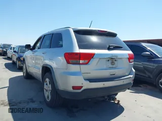2012 Jeep Grand Cherokee Laredo with VIN 1C4RJEAG5CC112230, listed as a IAAI auction lot 41997483 with 302,923 mi miles. Bid and sale history available at carsss.com. Image 3.