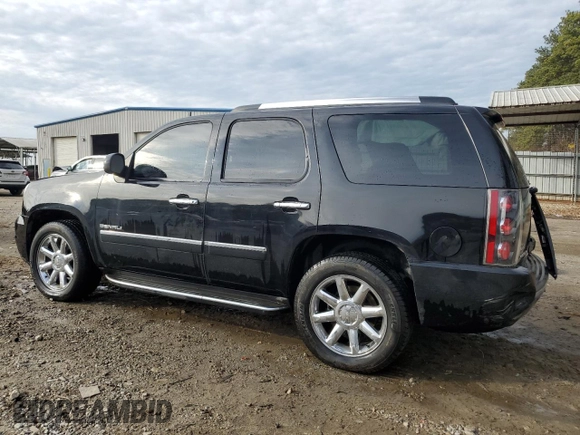 2012 GMC Yukon Denali with VIN 1GKS1EEF1CR304040, listed as a Copart auction lot 42874135 with 182,879 mi miles and Salvage Title. Bid and sale history available at carsss.com. Image 2.