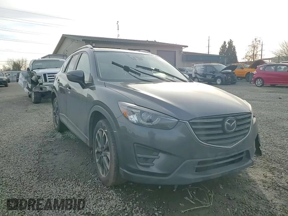 2016 Mazda CX-5 Grand Touring with VIN JM3KE4DY0G0876540, listed as a Copart auction lot 42132815 with 110,158 mi miles and Salvage Title. Bid and sale history available at DreamBid. Image 12.