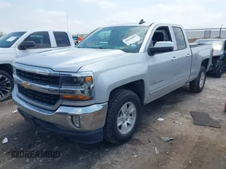 2018 Chevrolet Silverado 1500 LT with VIN 1GCRCREHXJZ336480, listed as a IAAI auction lot 42078864 with 140,366 mi miles and . Bid and sale history available at DreamBid. Image 2.