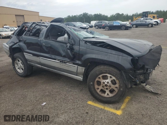 2000 Jeep Grand Cherokee Laredo with VIN 1J4G248S4YC390675, listed as a Copart auction lot 55652815 with Not provided miles and Salvage title. Bid and sale history available at DreamBid. Image 4.