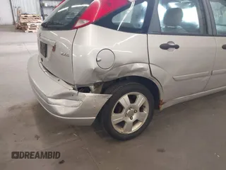 2005 Ford Focus S with VIN 3FAFP37N15R138393, listed as a IAAI auction lot 42106817 with 144,047 mi miles and . Bid and sale history available at carsss.com. Image 6.